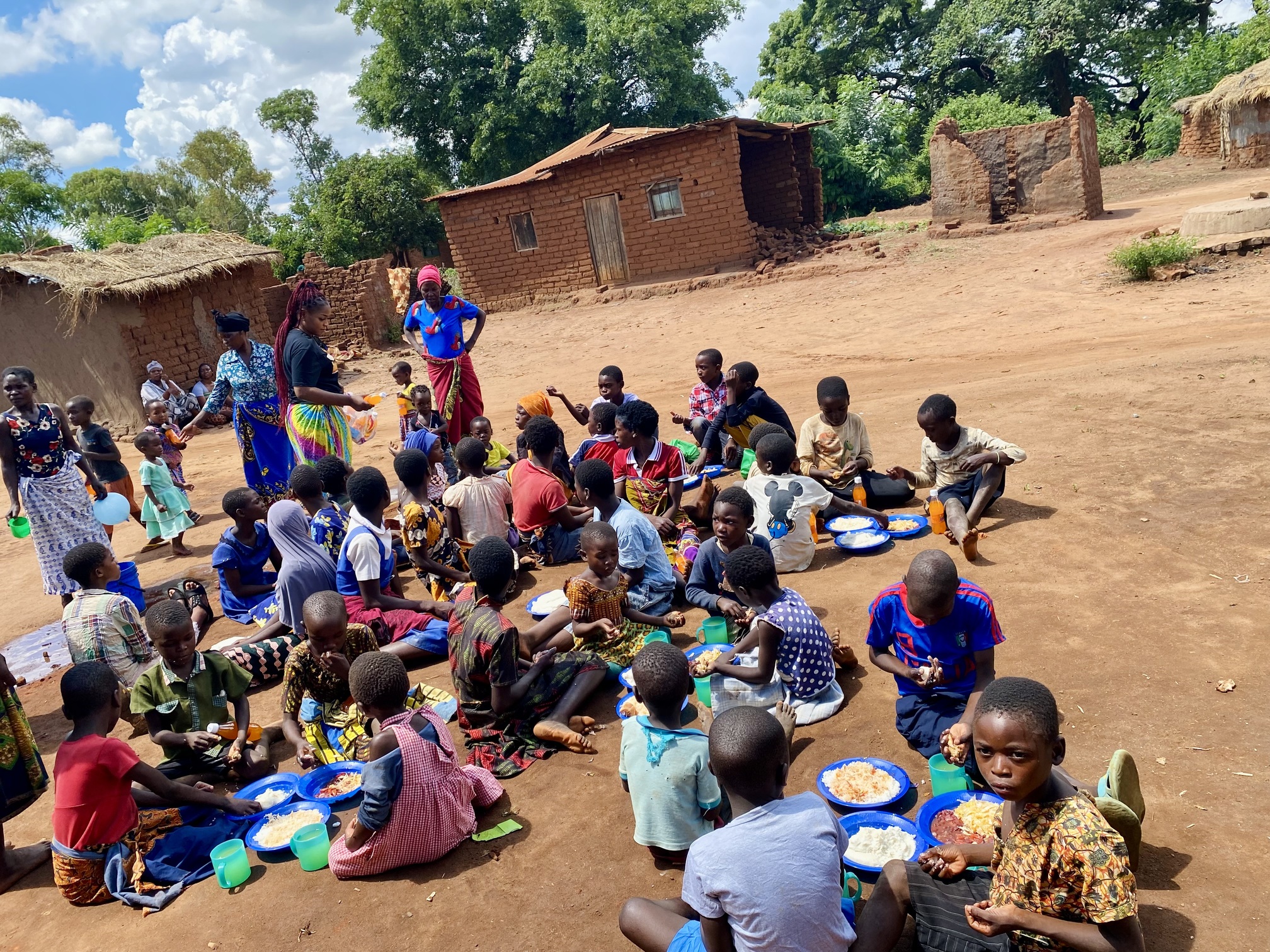 Children gathered for a meal in Mphathi village